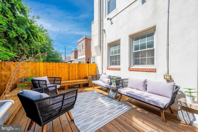 wooden deck featuring outdoor lounge area