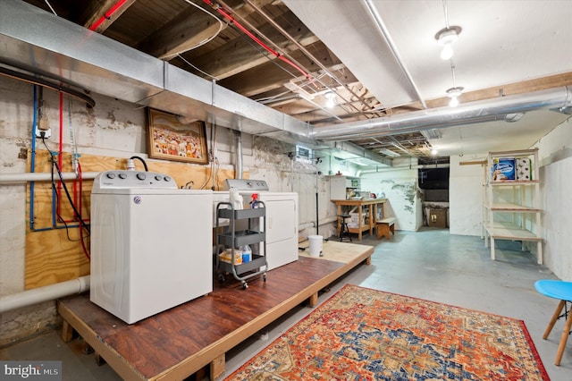 basement with washing machine and clothes dryer