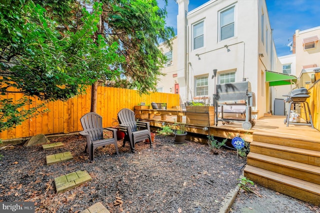 back of house with a wooden deck