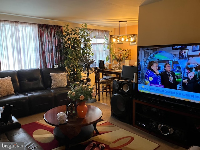 living room with an inviting chandelier