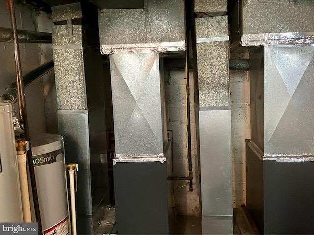 utility room featuring gas water heater