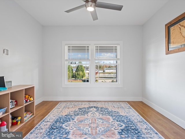 interior space featuring light wood-type flooring and ceiling fan