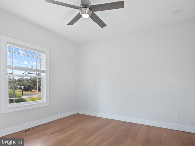 empty room with wood-type flooring and ceiling fan