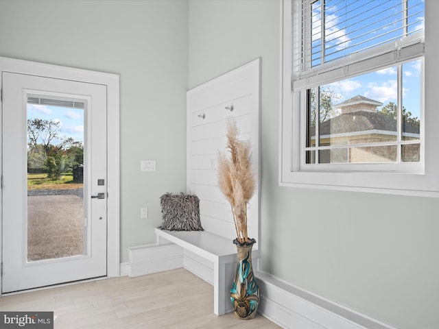 mudroom with light hardwood / wood-style flooring