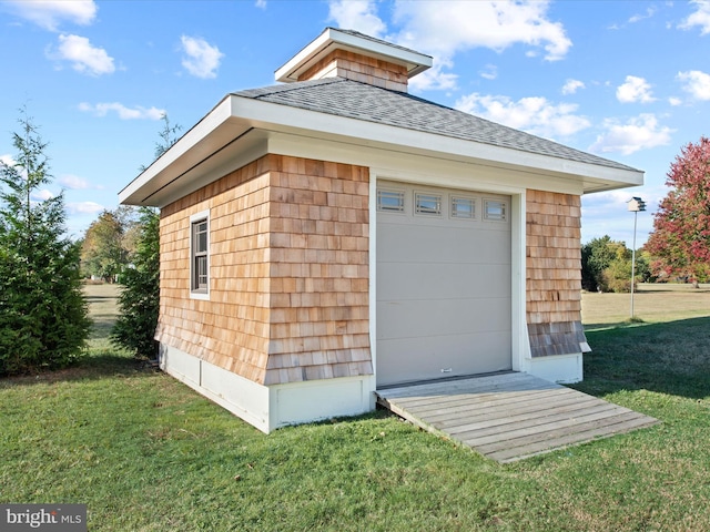 garage with a yard