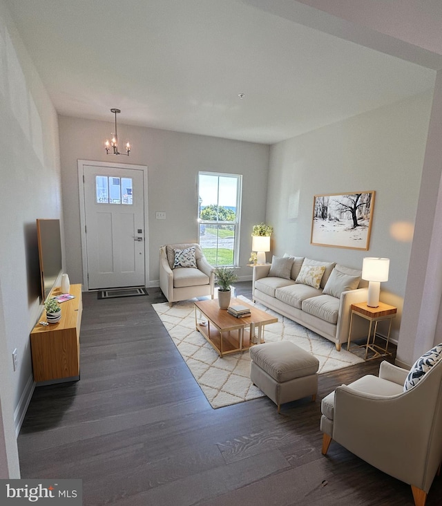 living room featuring light hardwood / wood-style floors and a chandelier