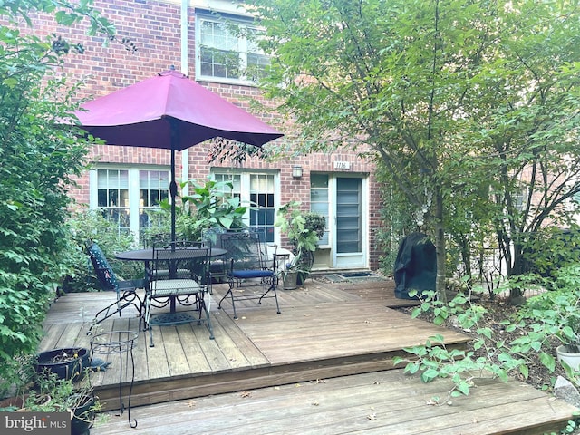 wooden deck featuring grilling area