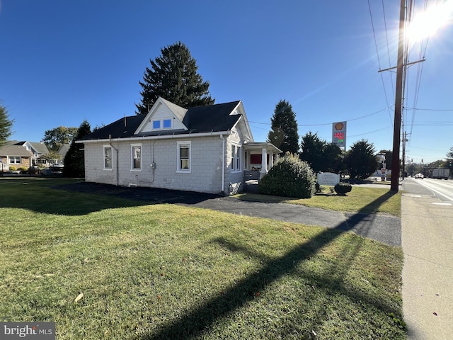 view of property exterior featuring a yard