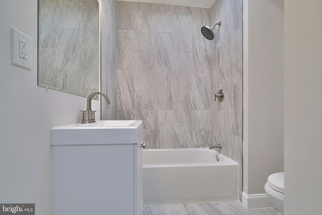 full bathroom featuring hardwood / wood-style floors, vanity, toilet, and tiled shower / bath