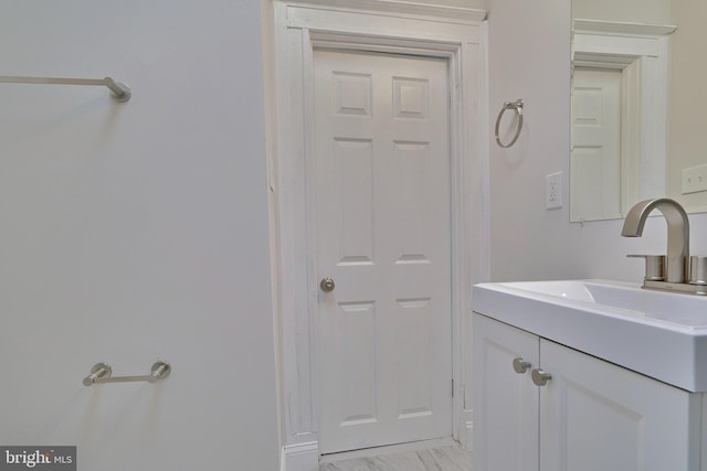 bathroom with vanity and hardwood / wood-style floors