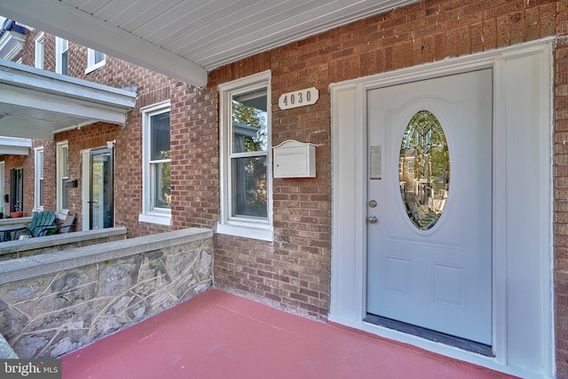 property entrance featuring covered porch