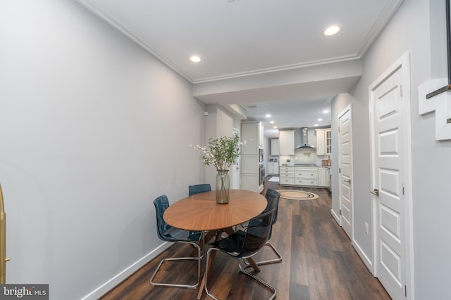 dining room featuring crown molding and dark hardwood / wood-style flooring