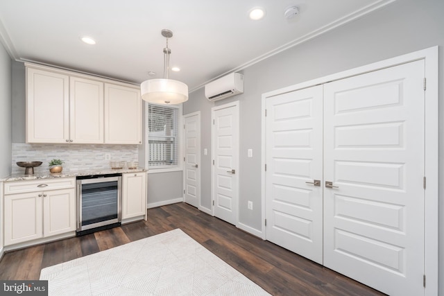 kitchen featuring pendant lighting, wine cooler, backsplash, dark wood-type flooring, and an AC wall unit