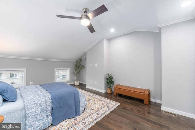 bedroom featuring multiple windows, ceiling fan, dark wood-type flooring, and vaulted ceiling