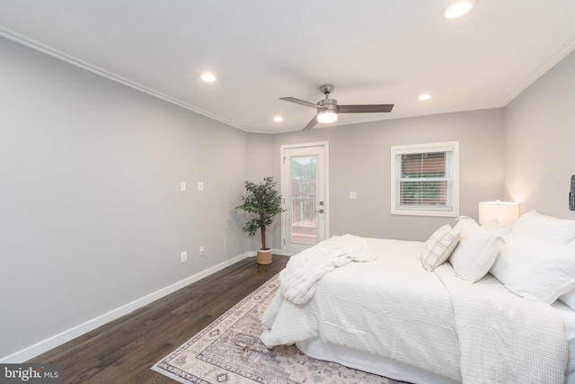 bedroom featuring ceiling fan, ornamental molding, and dark hardwood / wood-style flooring