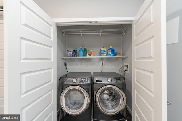 laundry area with washing machine and dryer