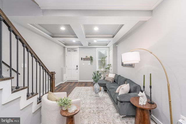 living room with beam ceiling, coffered ceiling, ornamental molding, and dark hardwood / wood-style floors