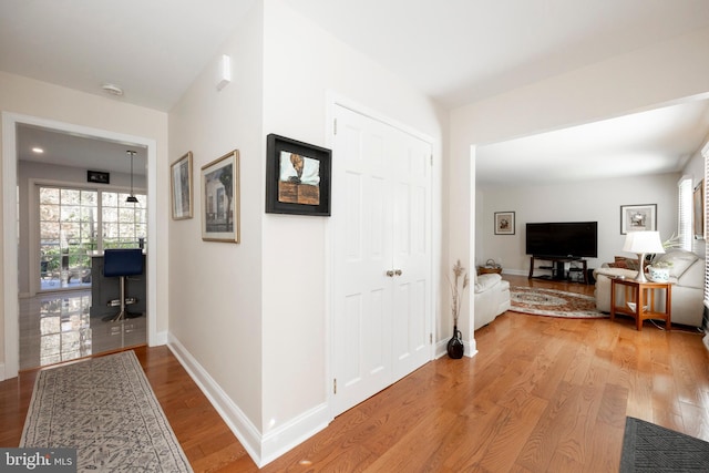 corridor featuring light hardwood / wood-style flooring