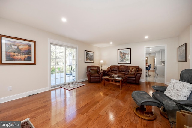 living room with light hardwood / wood-style flooring