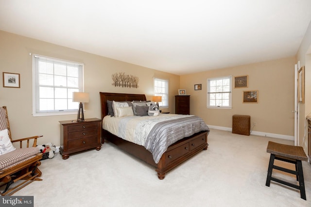 bedroom featuring light colored carpet