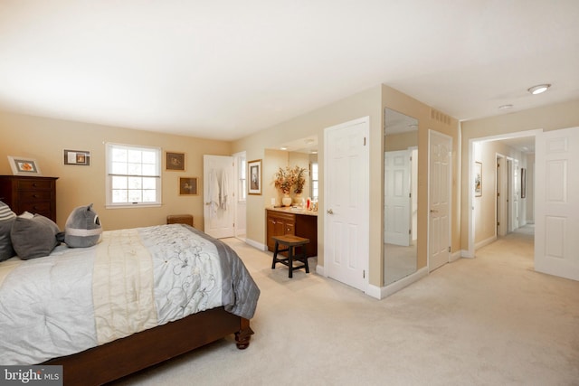 bedroom with light carpet