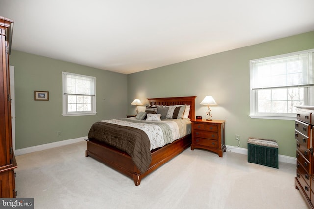 bedroom featuring light carpet