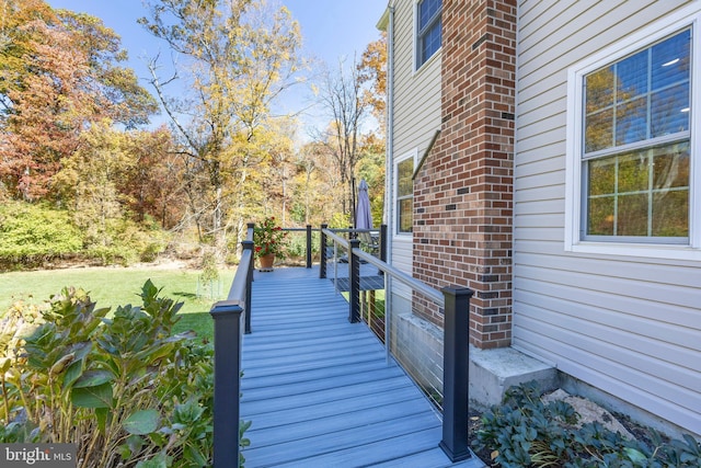 wooden deck with a yard