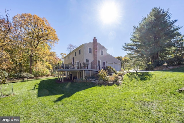 view of yard with a deck and a garage