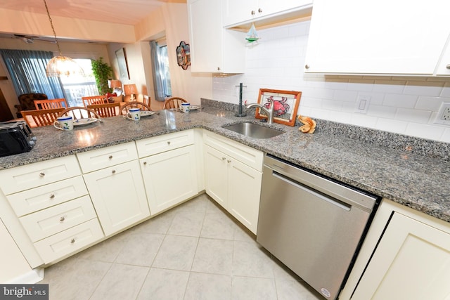 kitchen featuring a sink, white cabinets, light tile patterned flooring, and dishwasher