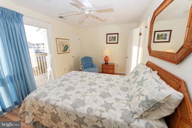 bedroom featuring visible vents, access to exterior, wood finished floors, and ceiling fan