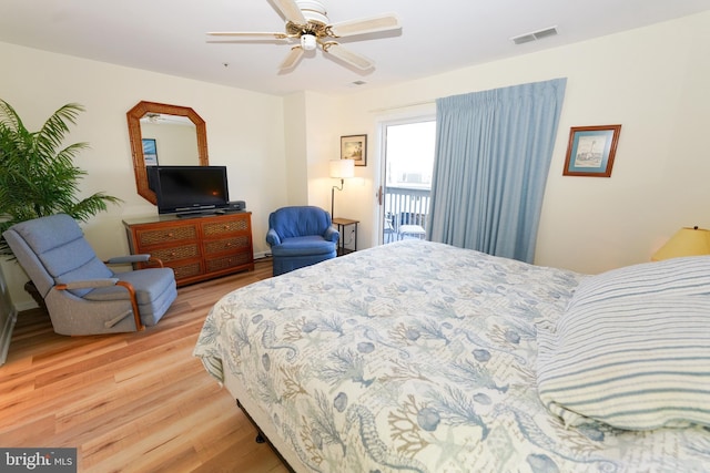 bedroom with visible vents, ceiling fan, and light wood finished floors