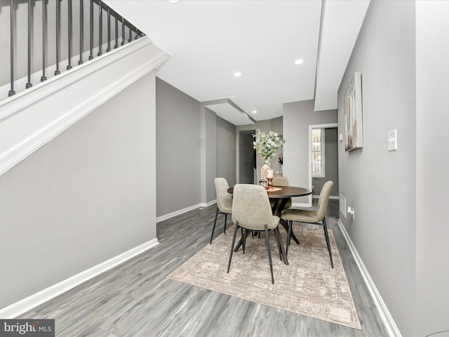 dining area with hardwood / wood-style floors