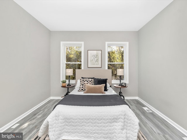 bedroom with hardwood / wood-style floors