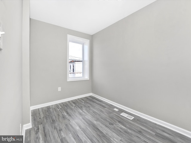 unfurnished room featuring hardwood / wood-style floors