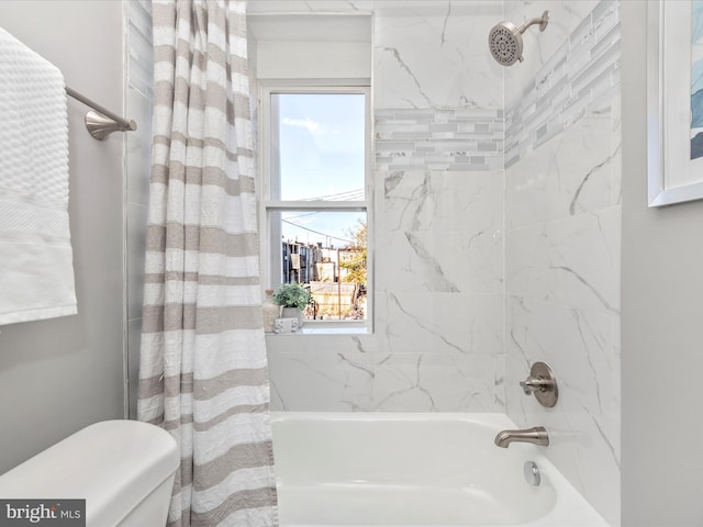 bathroom featuring toilet and shower / bathtub combination with curtain