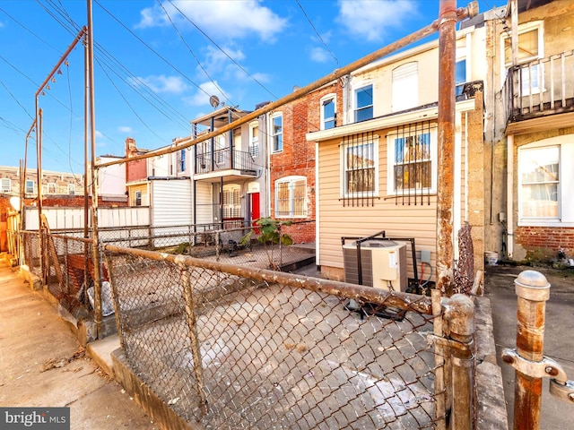 exterior space with a balcony and central AC