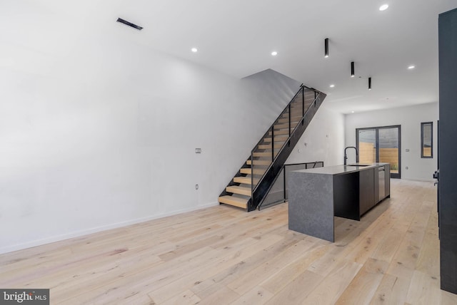 interior space featuring hardwood / wood-style floors and sink