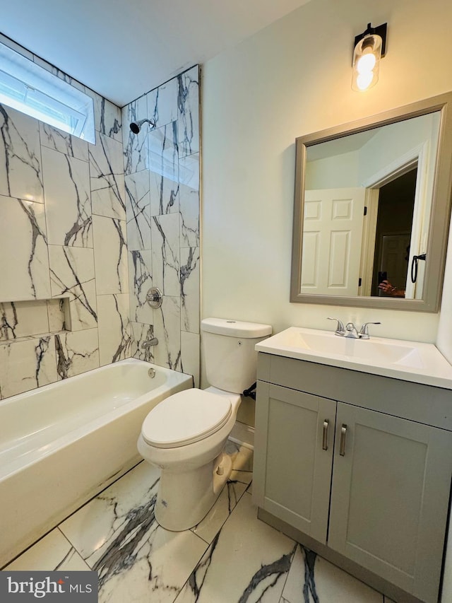 full bathroom with toilet, tiled shower / bath combo, and vanity