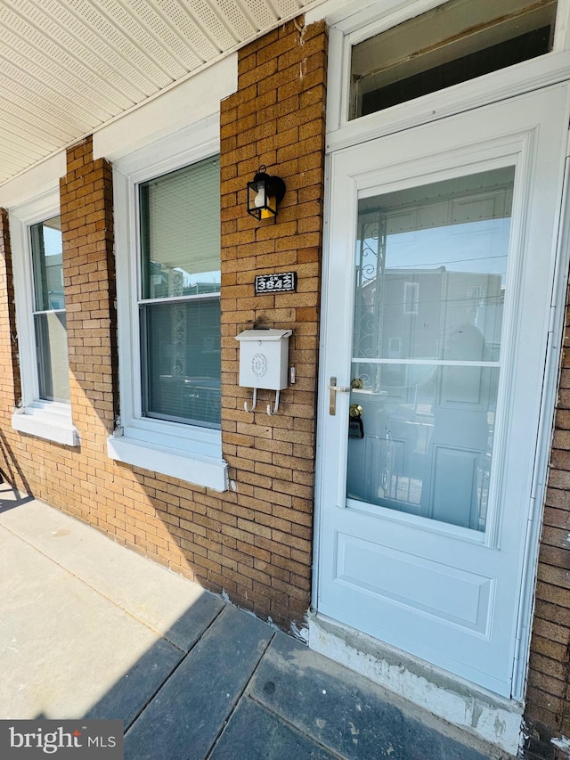 doorway to property with a porch