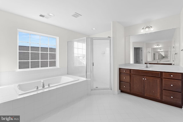 bathroom with vanity, plus walk in shower, and tile patterned flooring