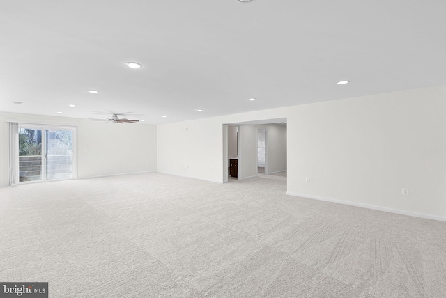 carpeted empty room with ceiling fan