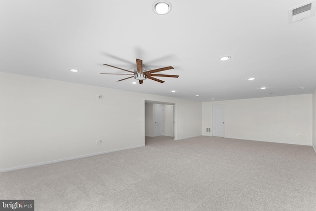 carpeted empty room featuring ceiling fan