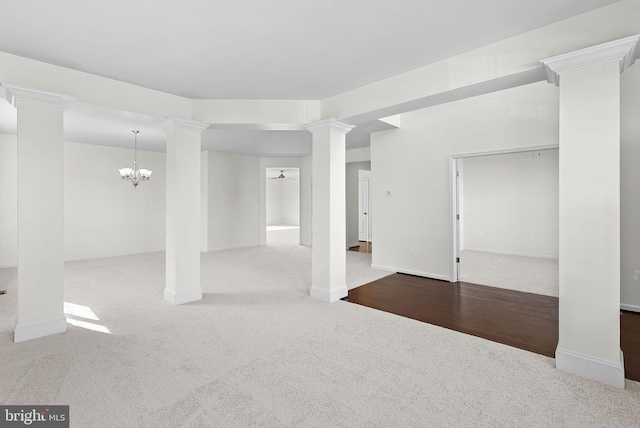 interior space with a notable chandelier and carpet floors