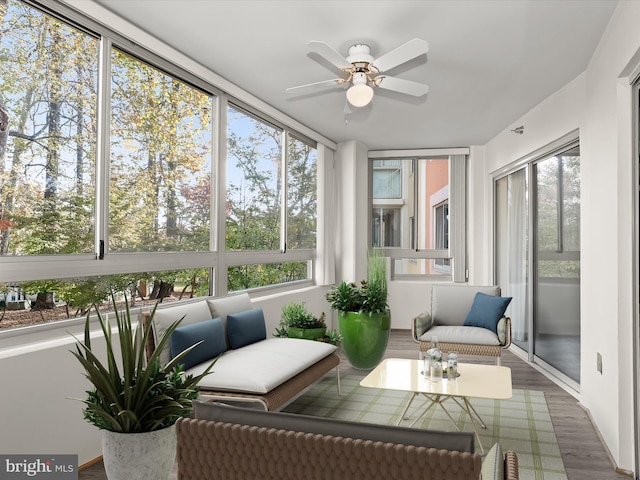 sunroom / solarium featuring ceiling fan