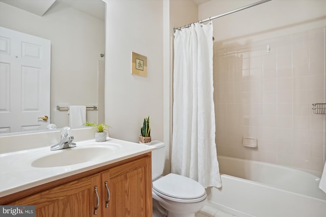 full bathroom featuring shower / bath combo with shower curtain, tile patterned flooring, vanity, and toilet