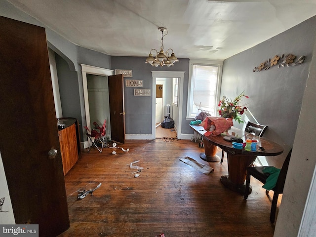 interior space featuring dark hardwood / wood-style floors and a chandelier