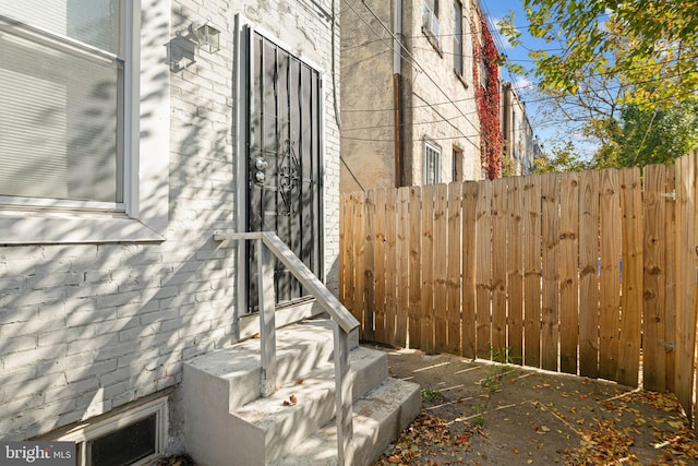 view of property exterior featuring fence