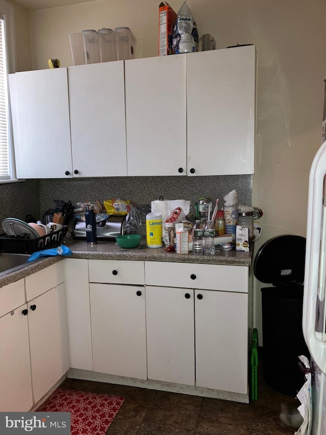 kitchen featuring white cabinetry