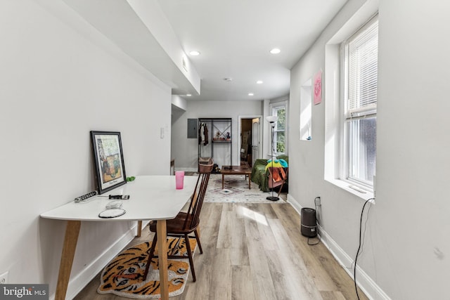 office space featuring light hardwood / wood-style floors and a healthy amount of sunlight