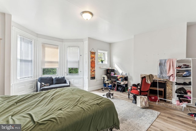 bedroom with light hardwood / wood-style floors